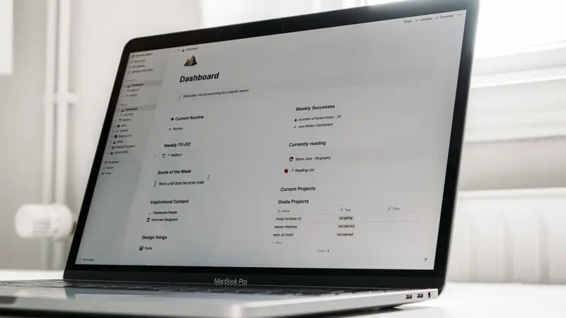 Organized desk with labeled folders and a computer